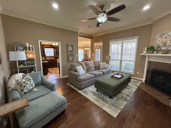 a living room with furniture and a fireplace