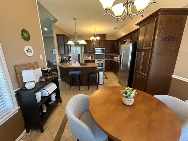 a view of a dining room with furniture