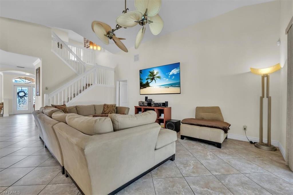 12914 Stone Tower Loop Fort Myers, FL 33913 - Photo 13 of 50 a living room with furniture ceiling fan and a rug