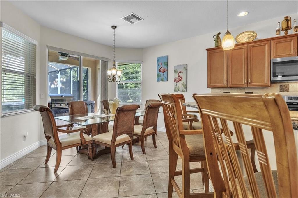 12914 Stone Tower Loop Fort Myers, FL 33913 - Photo 16 of 50 a view of a dining room with furniture window and outside view