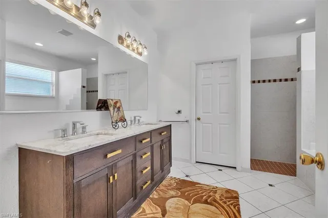 a spacious bathroom with a double vanity sink double and mirror