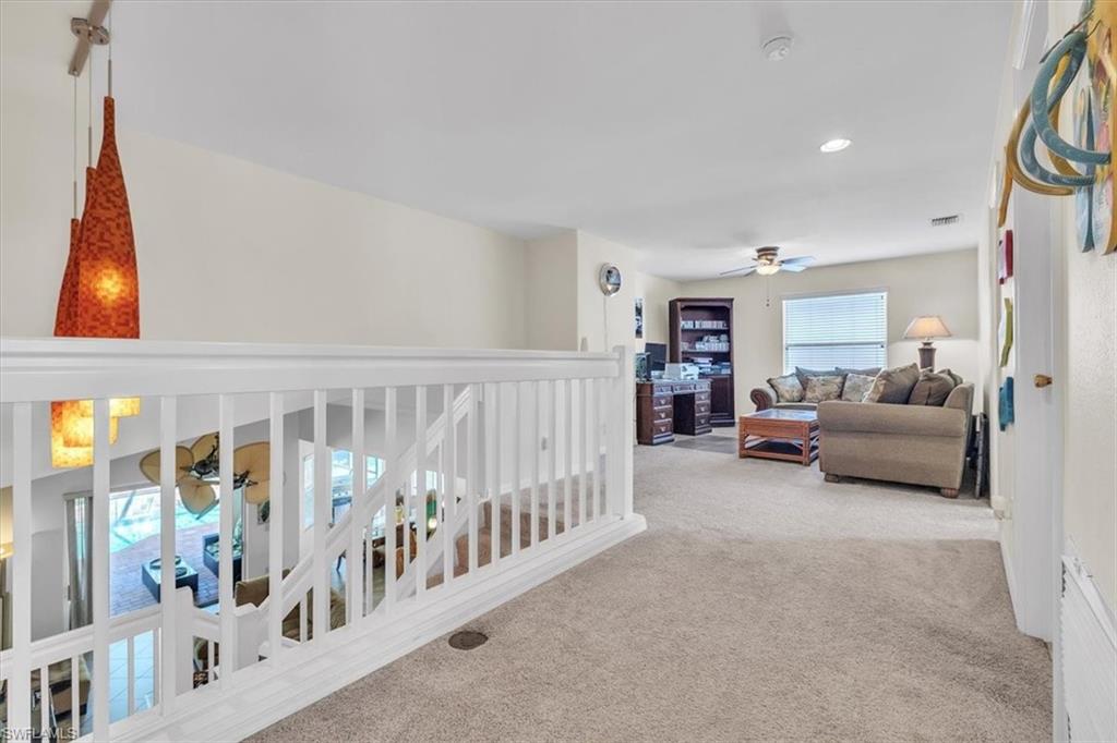 12914 Stone Tower Loop Fort Myers, FL 33913 - Photo 23 of 50 a living room with furniture and white walls