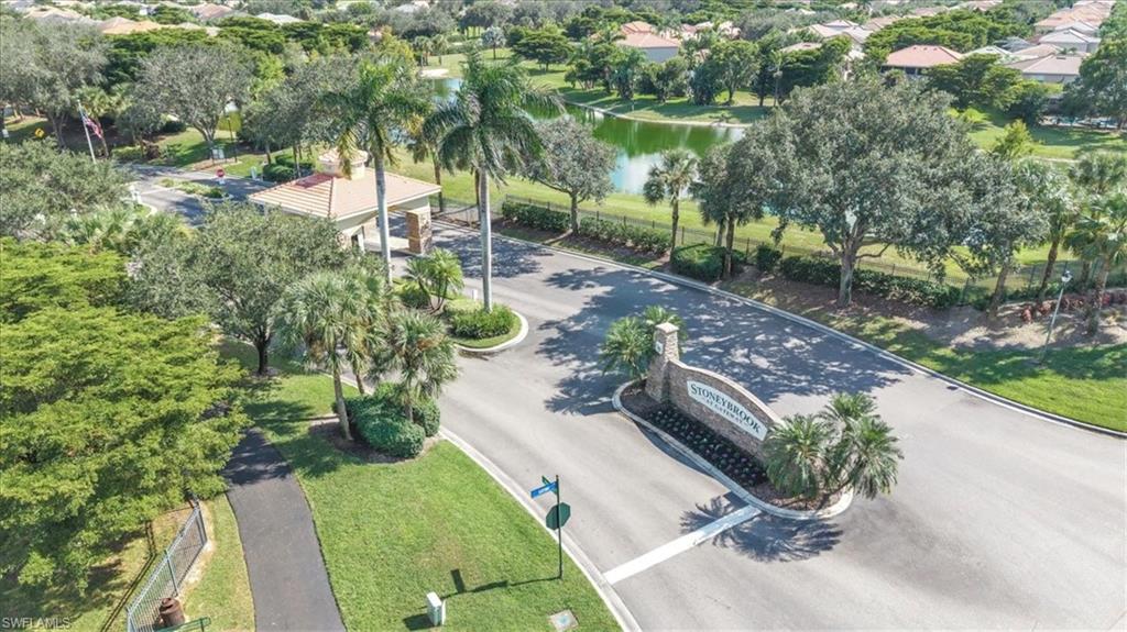 12914 Stone Tower Loop Fort Myers, FL 33913 - Photo 43 of 50 a view of a garden with a lake