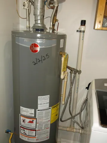 a view of a storage & utility room with a sink