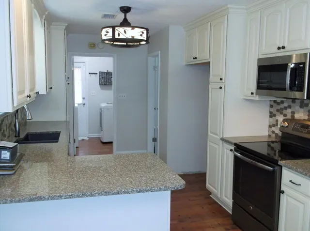 an empty room with a chandelier