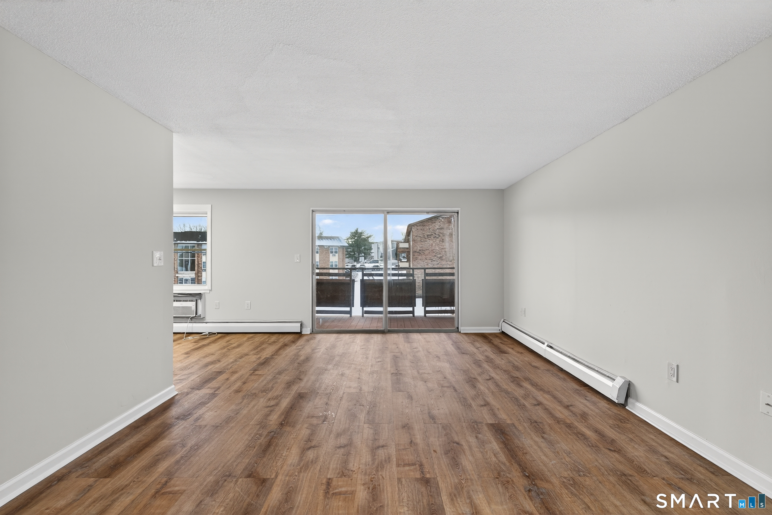 45 Jefferson Road, Unit 37 Branford, CT 06405 - Photo 11 of 24 wooden floor in an empty room with a window