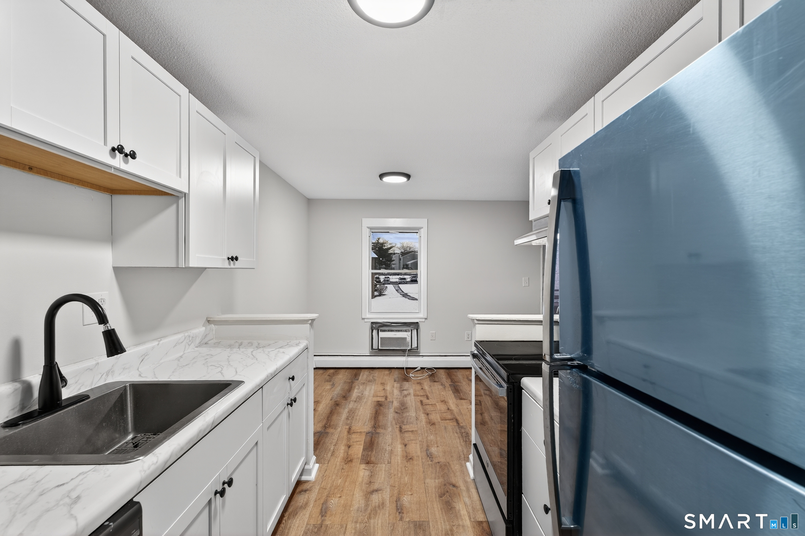 45 Jefferson Road, Unit 37 Branford, CT 06405 - Photo 14 of 24 a kitchen with a refrigerator and a sink