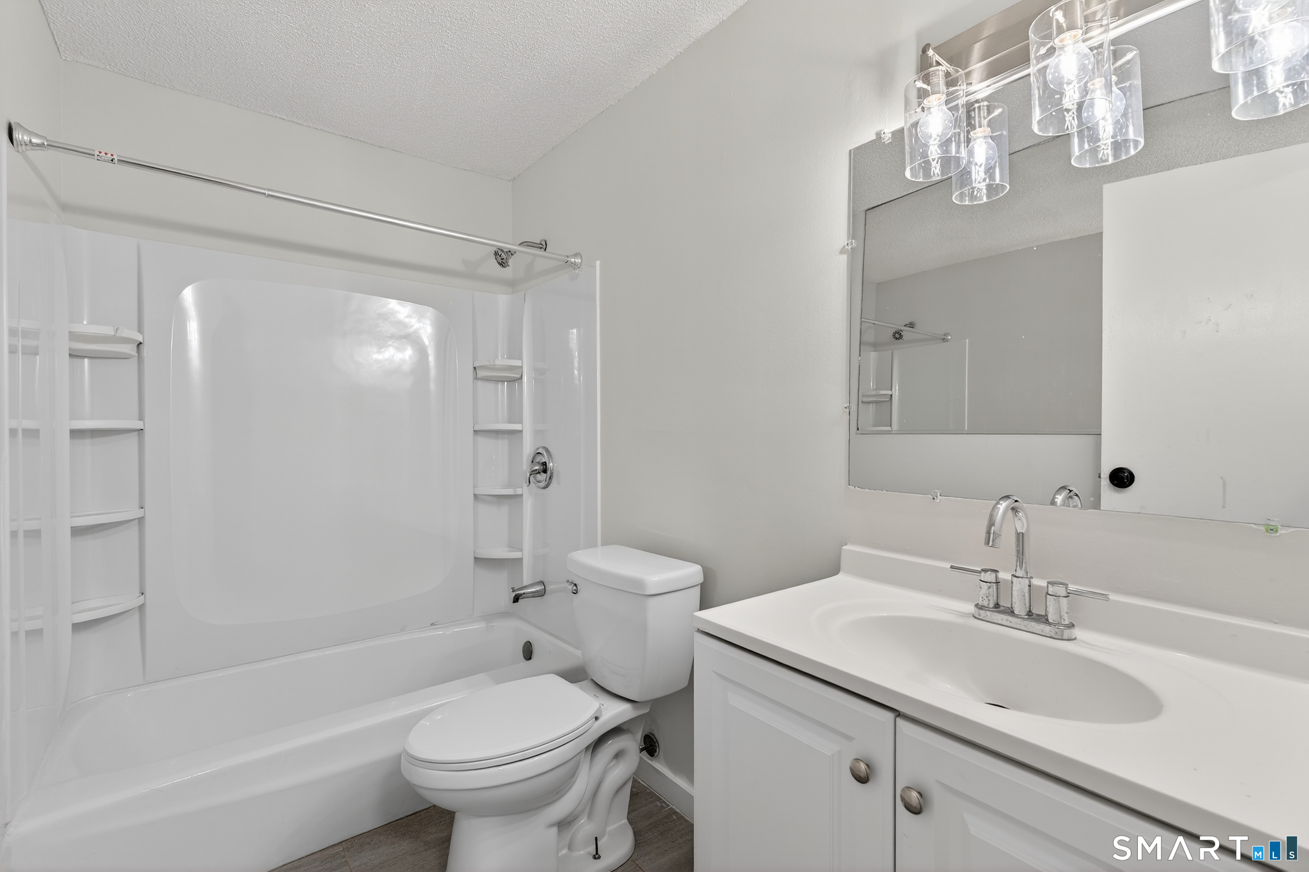 45 Jefferson Road, Unit 37 Branford, CT 06405 - Photo 23 of 24 a bathroom with a sink a toilet and shower