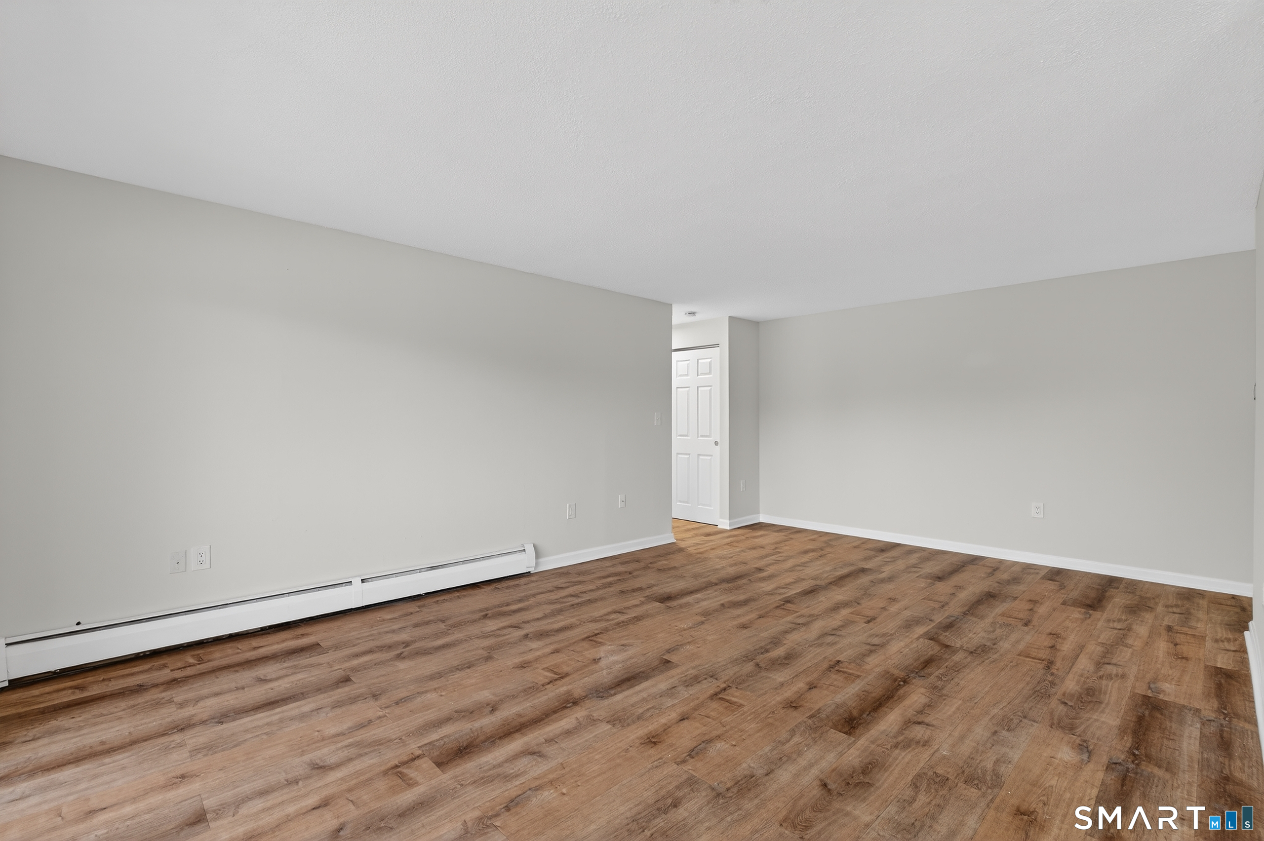 45 Jefferson Road, Unit 37 Branford, CT 06405 - Photo 9 of 24 a view of an empty room and wooden floor