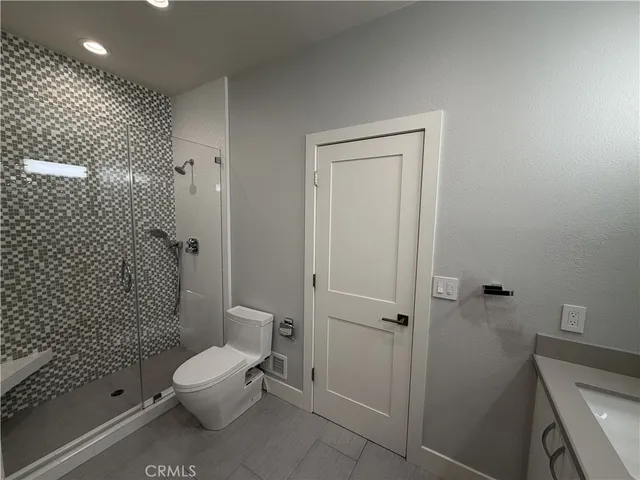 a very nice looking room with wooden floor and a window