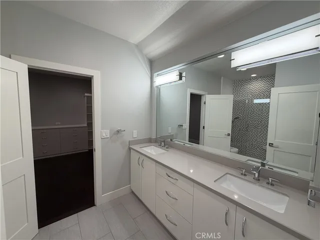 a bed room with a bed and a window