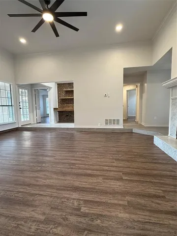 a view of a livingroom with wooden floor