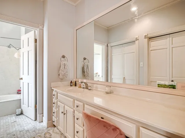 a bathroom with a double vanity sink mirror and double