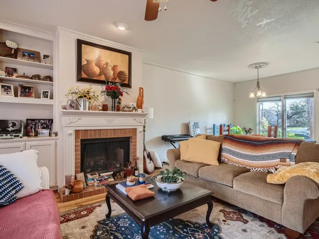 a living room with furniture and a fireplace