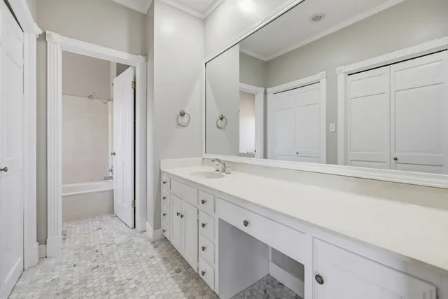 a bathroom with a bathtub and window