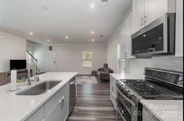 a kitchen with a stove and a microwave