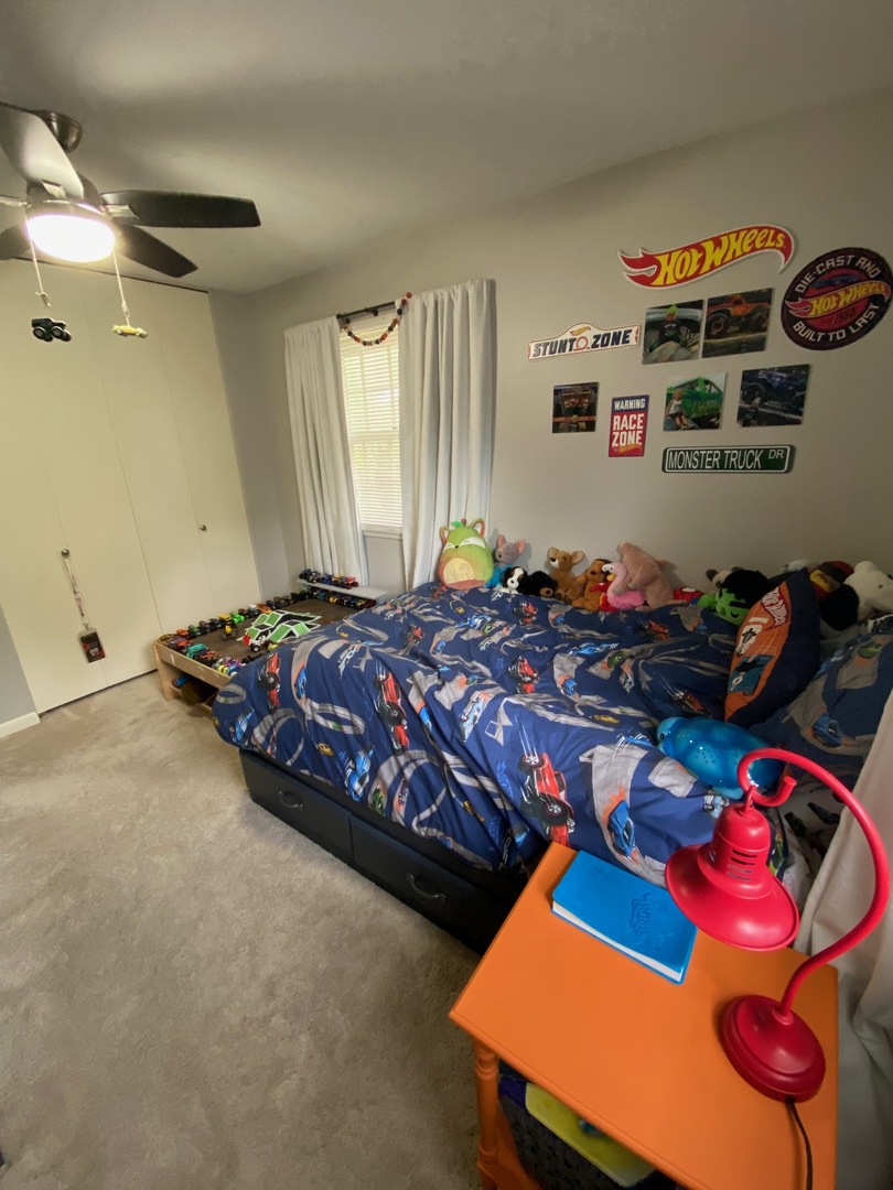 1902 Crescent Drive Champaign, IL 61821 - Photo 13 of 24 a bedroom with bed and a window