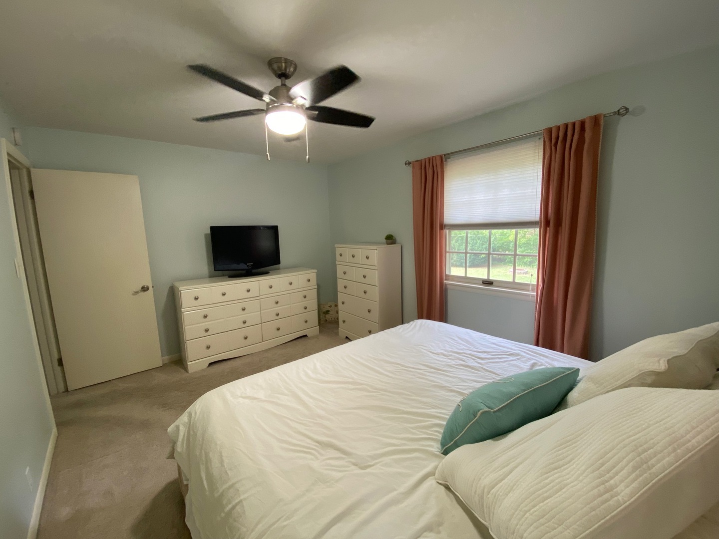 1902 Crescent Drive Champaign, IL 61821 - Photo 17 of 24 a bedroom with a bed and a flat tv screen on dresser