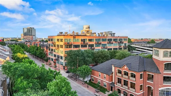 a view of a building with a yard
