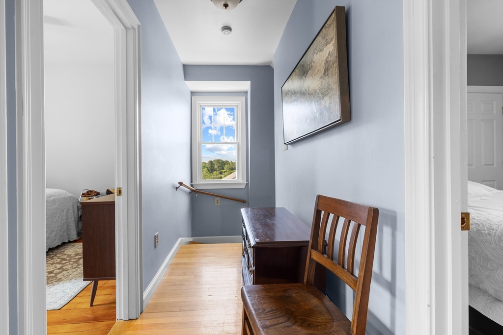 11 Saucier Street Acushnet, MA 02743 - Photo 16 of 35 a view of a hallway to a livingroom with furniture and wooden floor
