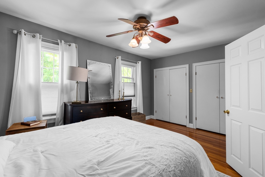 11 Saucier Street Acushnet, MA 02743 - Photo 17 of 35 a bedroom with a bed and a chandelier