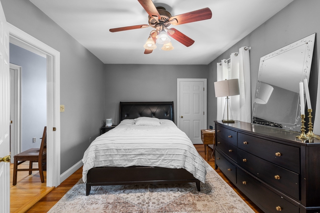 11 Saucier Street Acushnet, MA 02743 - Photo 18 of 35 a bedroom with a bed and a mirror on dresser