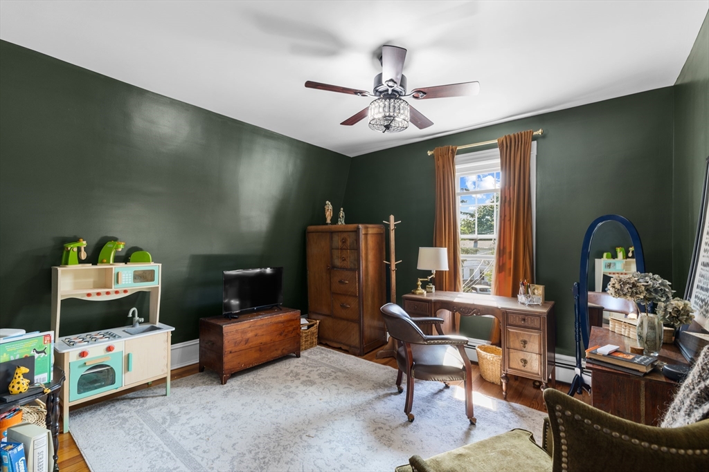 11 Saucier Street Acushnet, MA 02743 - Photo 19 of 35 a view of a workspace with furniture and a flat screen tv