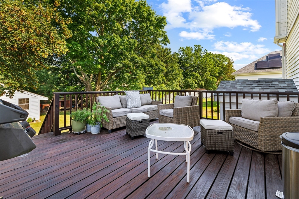 11 Saucier Street Acushnet, MA 02743 - Photo 24 of 35 a balcony with wooden floor and furniture