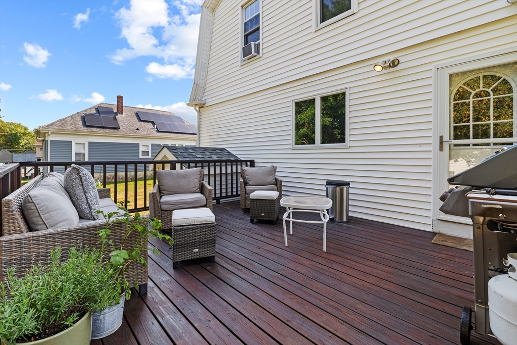 11 Saucier Street Acushnet, MA 02743 - Photo 25 of 35 a view of a patio with couches table and chairs and wooden floor