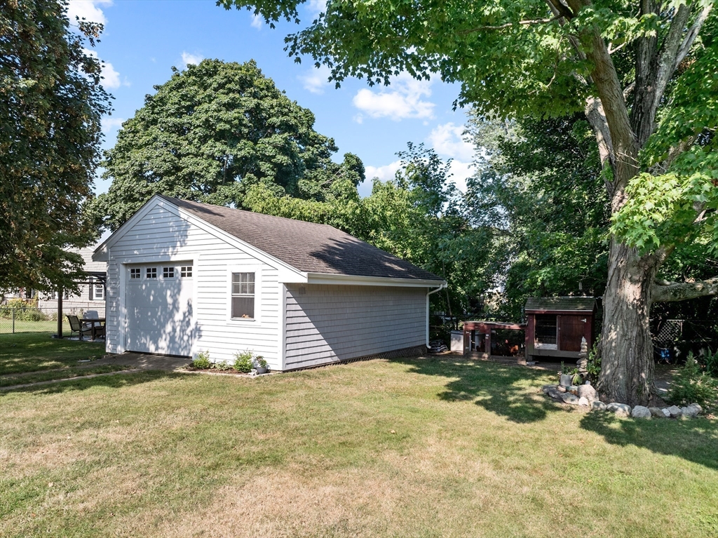 11 Saucier Street Acushnet, MA 02743 - Photo 28 of 35 a front view of house with yard and trees around