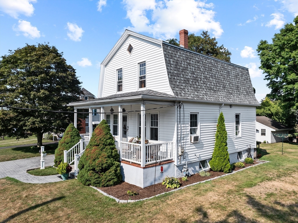 11 Saucier Street Acushnet, MA 02743 - Photo 30 of 35 a front view of a house with a yard and potted plants