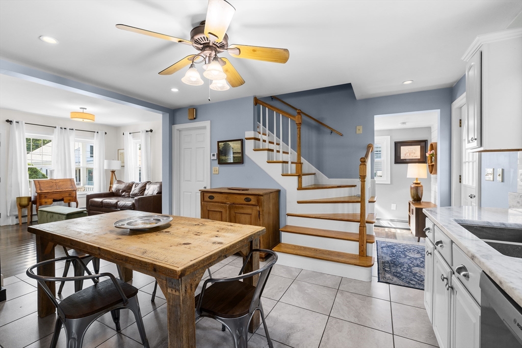 11 Saucier Street Acushnet, MA 02743 - Photo 3 of 35 a kitchen with a table chairs and white cabinets