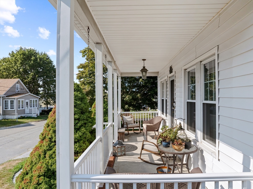 11 Saucier Street Acushnet, MA 02743 - Photo 32 of 35 a view of a porch with furniture and floor to ceiling window
