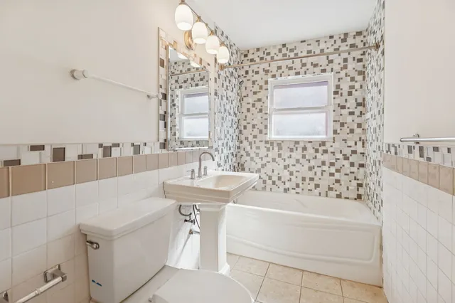 a bathroom with a bathtub and shower