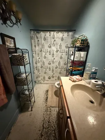 a bathroom with a sink and mirror