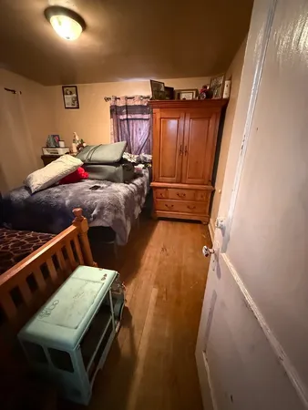 a bed room with furniture and a window