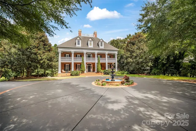 a view of a house with swimming pool and porch