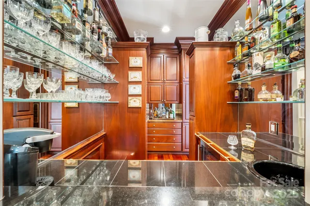 a kitchen with stainless steel appliances a stove a sink and cabinets