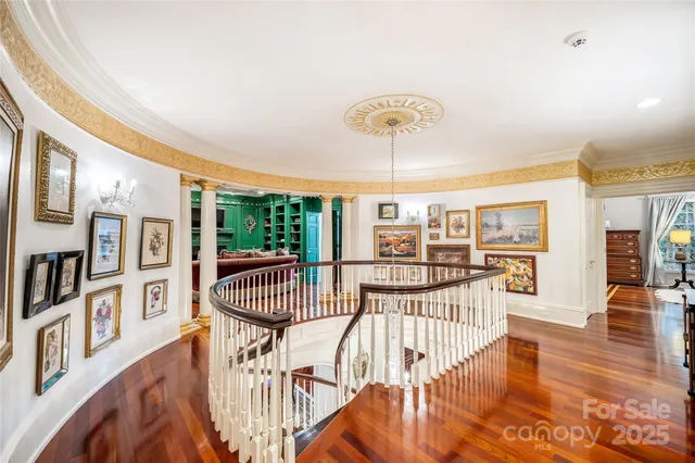 a living room with furniture a bookshelf and a fireplace