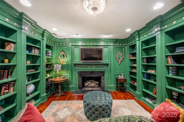 a view of entryway livingroom and hall with wooden floor