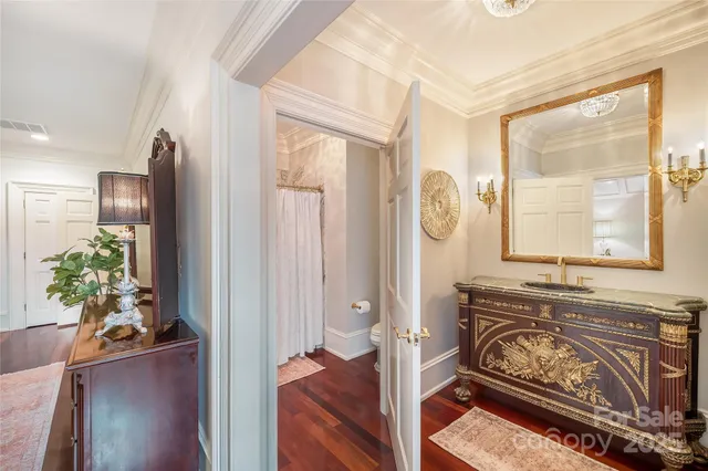 a bedroom with furniture and a chandelier