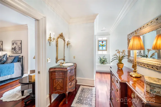 a living room with furniture tv and a large window