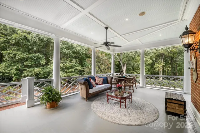 a living room with pool table and a pool table