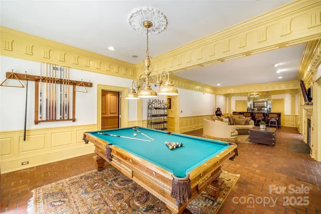 a view of a patio with couches table and chairs and potted plants