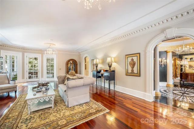 a living room with furniture rug and window