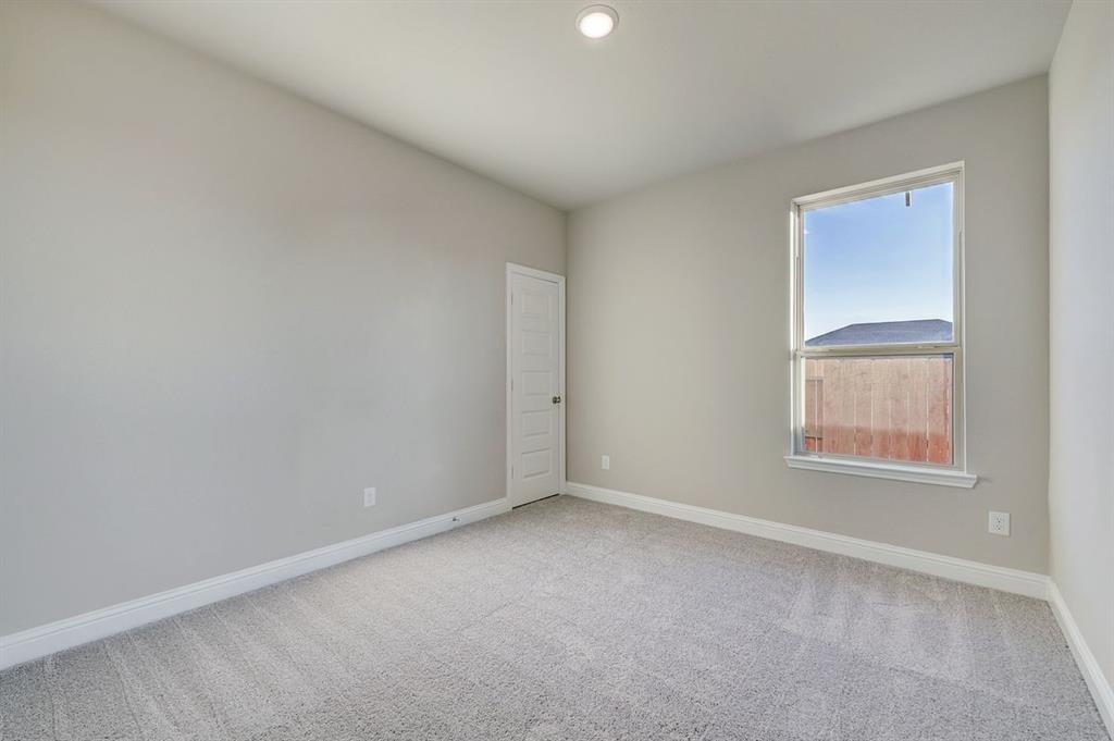 125 Toftrees Drive Cleburne, TX 76031 - Photo 18 of 22 an empty room with a window