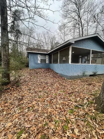 a front view of a house with yard