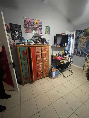 a room with furniture and a flat screen tv