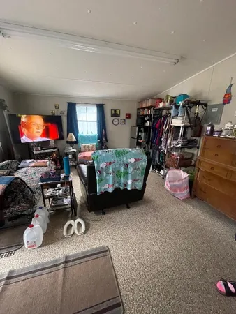 a room with furniture and a flat screen tv