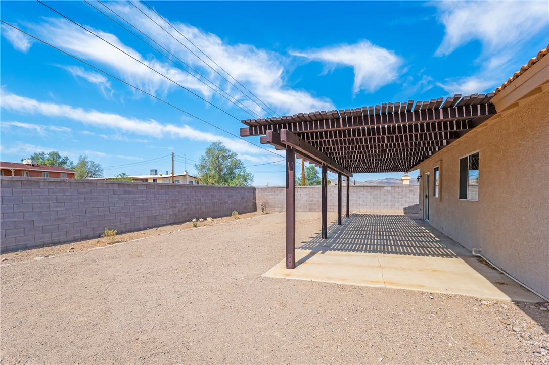 2524 South Ridge Avenue Bullhead City, AZ 86429 - Photo 53 of 64 Fenced backyard featuring a patio area